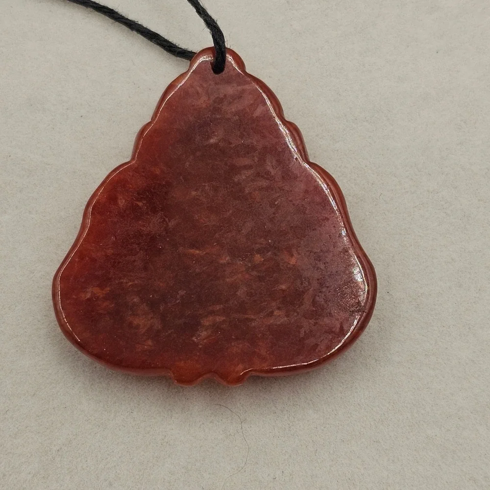 Carved Red Stone Laughing Buddha Pendant Black Cord Necklace Gold Tone Accent